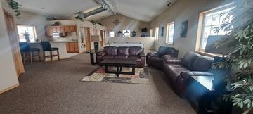 Kearney apartment for rent - a living room with couches and a table and a kitchen