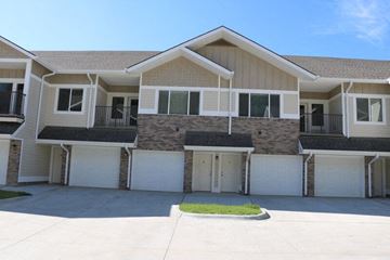 North Platte apartment for rent - a white and brown house with a garage door