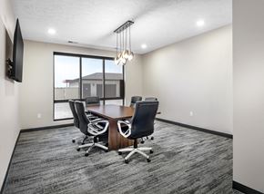 Lincoln apartment for rent - A conference room with a large table and chairs.