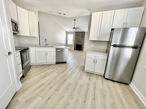 Omaha apartment for rent - West Omaha Luxury Apartments Upgraded Kitchen with white cabinets and stainless steel appliances