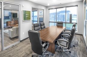 Lincoln apartment for rent - A conference room with a long table and chairs.
