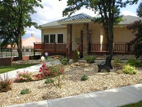 Topeka apartment for rent - The exterior of the Cedar Ridge Apartments clubhouse with a welcoming entrance.