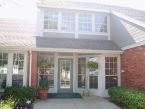 Wichita apartment for rent - The Northpark Apartments clubhouse exterior with a pathway leading to the entrance.