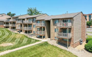 Omaha apartment for rent - an exterior view of an apartment building with balconies