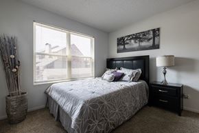 Mission townhouse for rent - A cozy and inviting bedroom with plenty of natural light.