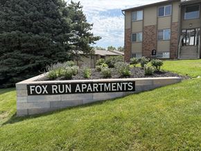 Omaha apartment for rent - Fox Run Apartments exterior sign welcoming residents to the Omaha community