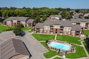 West Des Moines apartment for rent - Aerial view of Regency Woods community, showcasing the layout of the buildings and surrounding greenery.