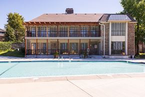 Overland Park apartment for rent - A spacious swimming pool area at Regent’s Walk Apartment Homes, ideal for unwinding.