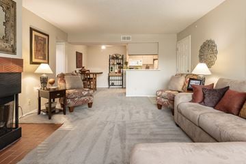 Kansas City apartment for rent - a living room with couches and chairs and a fireplace
