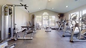 Overland Park apartment for rent - Fitness center at Three Lakes Community with a variety of exercise equipment.
