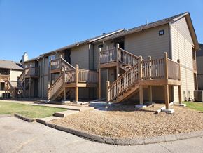 Wichita apartment for rent - Willow Creek Apartments Complex - Exterior view of the apartment buildings with landscaping.