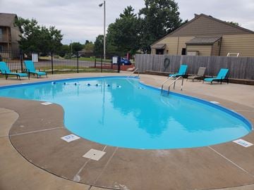 Wichita apartment for rent - A small pool with a brownish floor and blue water.