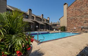 Mission townhouse for rent - A sparkling pool with lounge chairs and umbrellas for a relaxing afternoon.