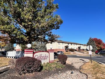 Omaha apartment for rent - our office is located on the corner of a street in front of a tree