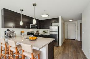 Seattle apartment for rent - A kitchen with a counter and chairs.