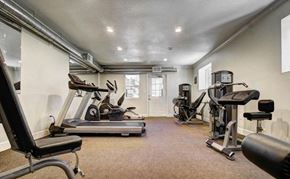 Phoenix apartment for rent - A spacious home gym with a variety of exercise equipment.