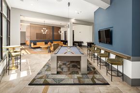 Decatur apartment for rent - a spacious game room with a pool table and a television