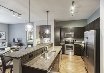 Baltimore apartment for rent - a kitchen with granite counter tops and stainless steel appliances