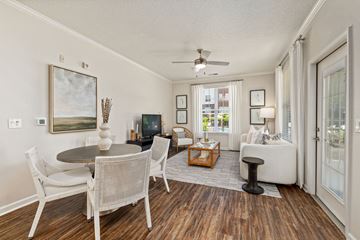 Raleigh apartment for rent - A living room with a dining table and chairs.