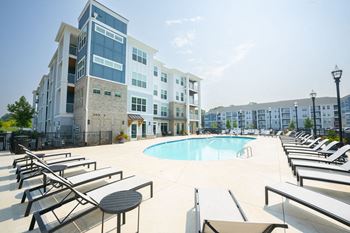 Retreat-inspired pool with tanning deck