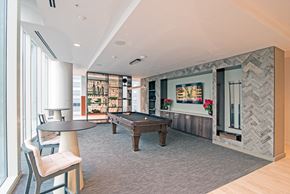 Nashville apartment for rent - A room with a pool table and a chair.
