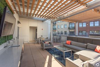 Rooftop deck with outdoor kitchen and seating