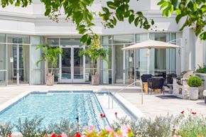 Charlotte apartment for rent - a view of the pool and the house from the garden
