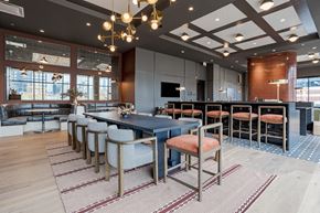 Chicago apartment for rent - A modern dining area with a long table and chairs.