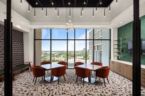 Atlanta apartment for rent - a dining room with a table and chairs in front of a window