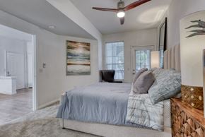 San Antonio apartment for rent - a bedroom with a bed and a ceiling fan