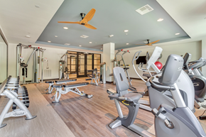 Dallas apartment for rent - a room filled with lots of different types of exercise equipment
