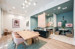 Maitland apartment for rent - A modern dining room with a wooden table and chairs.