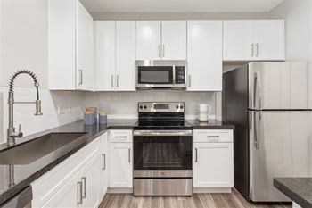 Newly upgraded apartment homes with stainless steel kitchen appliances, vinyl wood plank flooring and custom-designed kitchen cabinetry and countertops*