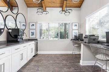 Marietta apartment for rent - A kitchen with white cabinets and a wooden ceiling.