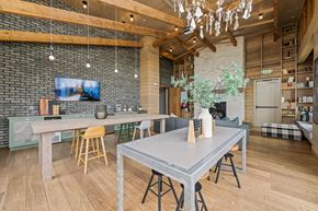 Charlotte apartment for rent - A modern dining area with a grey table and yellow chairs.