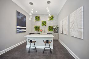 Fairfax apartment for rent - a kitchen with a white counter and three stools