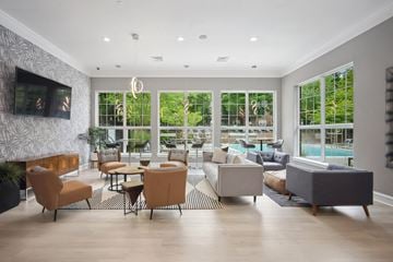 Fairfax apartment for rent - A living room with a television and a pool outside the window.