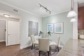 The Woodlands apartment for rent - A dining room with a glass table and chairs.