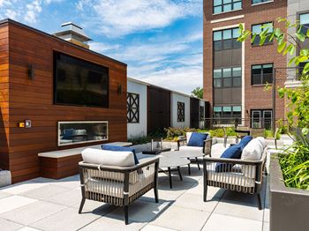 Outdoor lounge area with tv