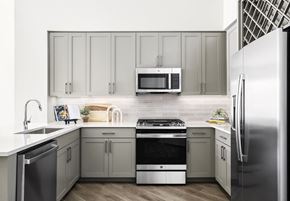 Chatham apartment for rent - a kitchen with stainless steel appliances and white cabinets at The Ivy, Chatham, NJ
