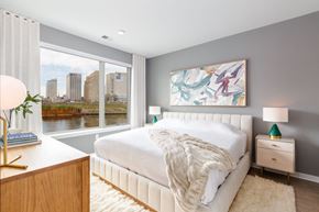 Harrison apartment for rent - a bedroom with a large window and a white bed at Dey & Bergen, New Jersey, 07029