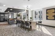 Hillsdale apartment for rent - A modern dining room with a long table and chairs.