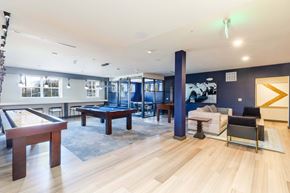 Fairfield apartment for rent - a game room with a pool table and a billiards table