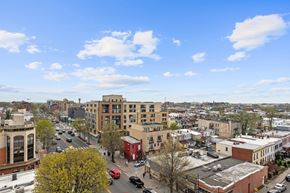 Washington apartment for rent - A city street with cars and buildings. at The Views at Georgia Ave, Washington, Washington