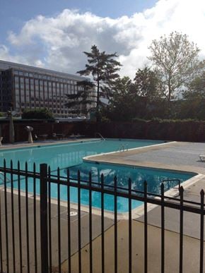 Washington apartment for rent - a large swimming pool with a black fence around it