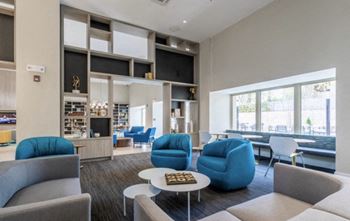 A living room with couches chairs and a coffee table