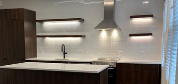 Floating underlit kitchen shelves