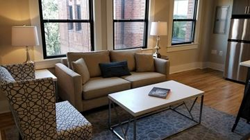 Washington apartment for rent - a living room with a couch and a coffee table