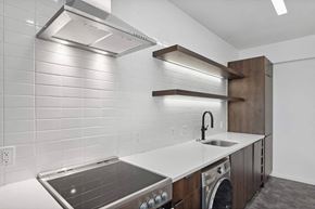 Washington apartment for rent - a kitchen with a stove top oven next to a sink