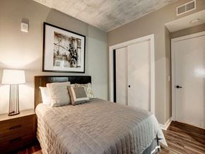 Washington apartment for rent - a bedroom with a bed and a picture on the wall at Coda on H Apartments, Washington, 20002